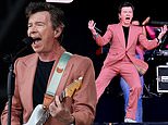 Rick Astley is on fine form as he takes to the stage in a pink suit for epic Glastonbury set